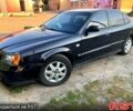 Черный Шевроле Эванда, объемом двигателя 2 л и пробегом 185 тыс. км за 3350 $, фото 1 на Automoto.ua