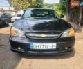 Черный Шевроле Эванда, объемом двигателя 2.5 л и пробегом 238 тыс. км за 3800 $, фото 1 на Automoto.ua