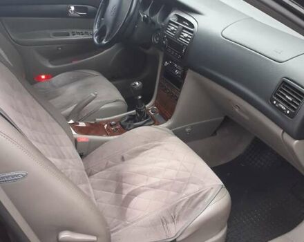 Черный Шевроле Эванда, объемом двигателя 2 л и пробегом 200 тыс. км за 3800 $, фото 1 на Automoto.ua