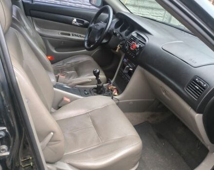 Черный Шевроле Эванда, объемом двигателя 2 л и пробегом 180 тыс. км за 3000 $, фото 2 на Automoto.ua