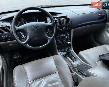 Чорний Шевроле Еванда, об'ємом двигуна 2 л та пробігом 303 тис. км за 2950 $, фото 7 на Automoto.ua