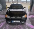 Черный Шевроле Эванда, объемом двигателя 2 л и пробегом 180 тыс. км за 3500 $, фото 1 на Automoto.ua