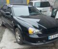 Черный Шевроле Эванда, объемом двигателя 2 л и пробегом 220 тыс. км за 4000 $, фото 2 на Automoto.ua