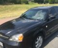Чорний Шевроле Еванда, об'ємом двигуна 2 л та пробігом 260 тис. км за 4300 $, фото 1 на Automoto.ua