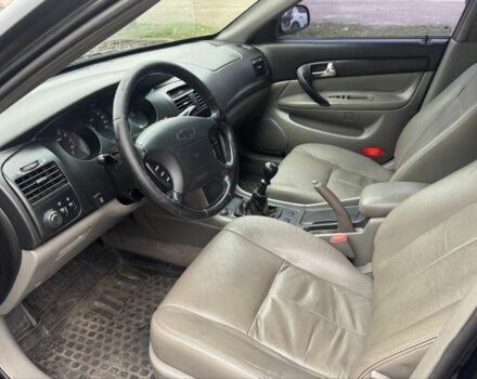 Чорний Шевроле Еванда, об'ємом двигуна 2 л та пробігом 303 тис. км за 2750 $, фото 4 на Automoto.ua