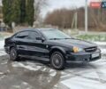 Чорний Шевроле Еванда, об'ємом двигуна 2 л та пробігом 250 тис. км за 3500 $, фото 1 на Automoto.ua