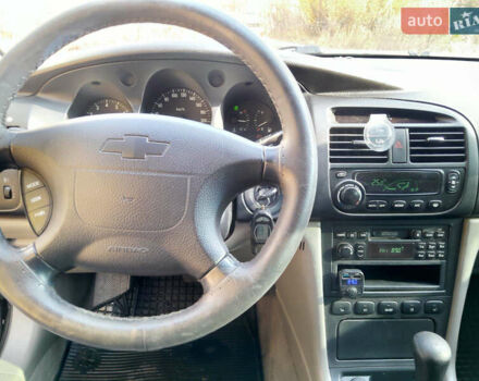 Черный Шевроле Эванда, объемом двигателя 2 л и пробегом 260 тыс. км за 4150 $, фото 1 на Automoto.ua