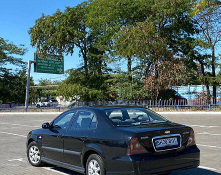 Черный Шевроле Эванда, объемом двигателя 2 л и пробегом 266 тыс. км за 3600 $, фото 1 на Automoto.ua