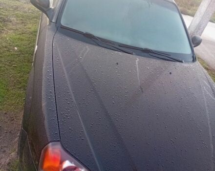 Черный Шевроле Эванда, объемом двигателя 2 л и пробегом 180 тыс. км за 5999 $, фото 1 на Automoto.ua