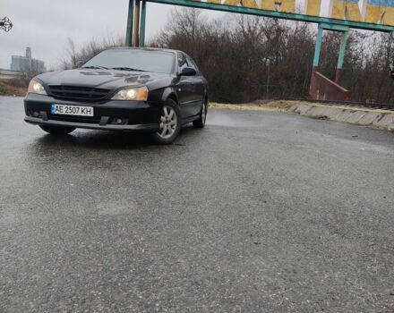 Черный Шевроле Эванда, объемом двигателя 2 л и пробегом 280 тыс. км за 3500 $, фото 1 на Automoto.ua