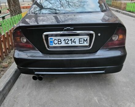 Черный Шевроле Эванда, объемом двигателя 2 л и пробегом 281 тыс. км за 2400 $, фото 1 на Automoto.ua