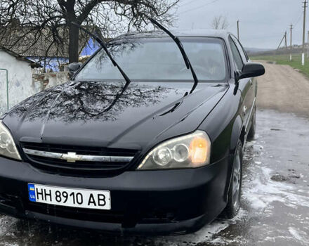 Черный Шевроле Эванда, объемом двигателя 2 л и пробегом 100 тыс. км за 2700 $, фото 1 на Automoto.ua