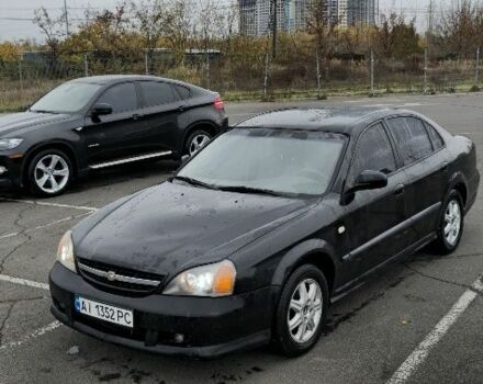 Черный Шевроле Эванда, объемом двигателя 2 л и пробегом 350 тыс. км за 3400 $, фото 1 на Automoto.ua
