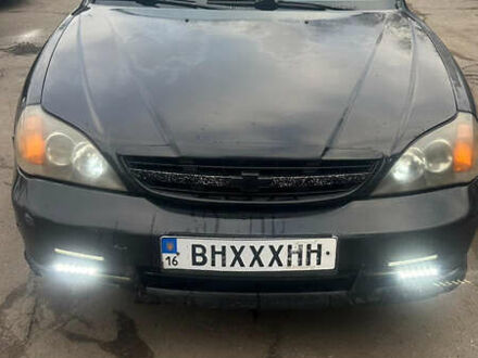 Черный Шевроле Эванда, объемом двигателя 2 л и пробегом 266 тыс. км за 3000 $, фото 1 на Automoto.ua