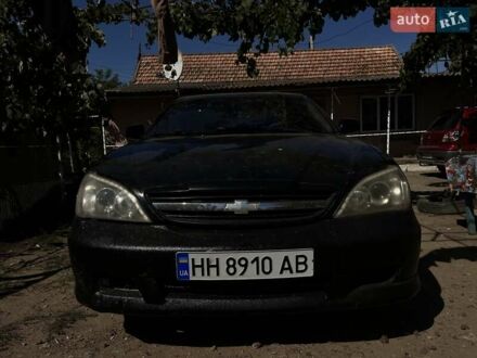 Черный Шевроле Эванда, объемом двигателя 2 л и пробегом 150 тыс. км за 3800 $, фото 1 на Automoto.ua