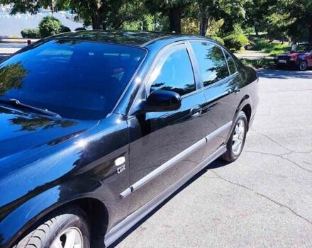 Чорний Шевроле Еванда, об'ємом двигуна 2 л та пробігом 290 тис. км за 4300 $, фото 1 на Automoto.ua