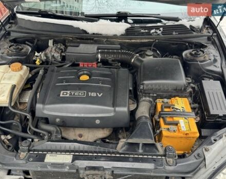 Черный Шевроле Эванда, объемом двигателя 2 л и пробегом 200 тыс. км за 3500 $, фото 1 на Automoto.ua