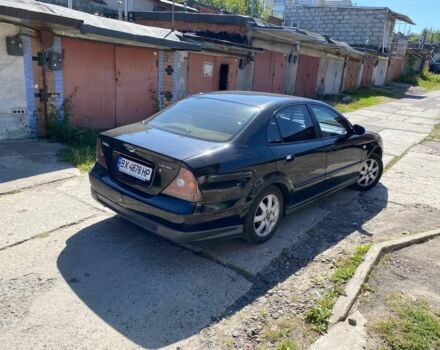 Чорний Шевроле Еванда, об'ємом двигуна 2 л та пробігом 220 тис. км за 1900 $, фото 1 на Automoto.ua