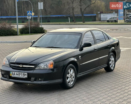 Черный Шевроле Эванда, объемом двигателя 2.5 л и пробегом 165 тыс. км за 3499 $, фото 1 на Automoto.ua