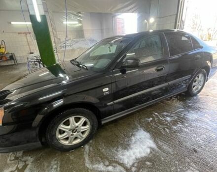 Черный Шевроле Эванда, объемом двигателя 2.5 л и пробегом 180 тыс. км за 4250 $, фото 1 на Automoto.ua