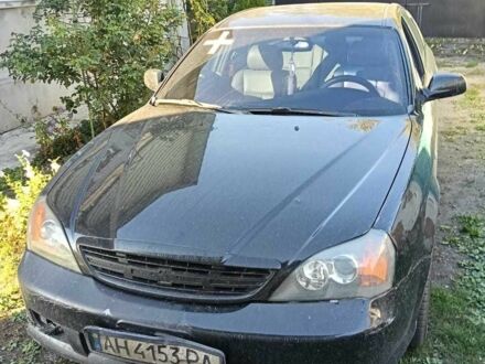 Черный Шевроле Эванда, объемом двигателя 2.5 л и пробегом 215 тыс. км за 3114 $, фото 1 на Automoto.ua