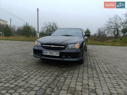 Чорний Шевроле Еванда, об'ємом двигуна 2 л та пробігом 178 тис. км за 5100 $, фото 1 на Automoto.ua