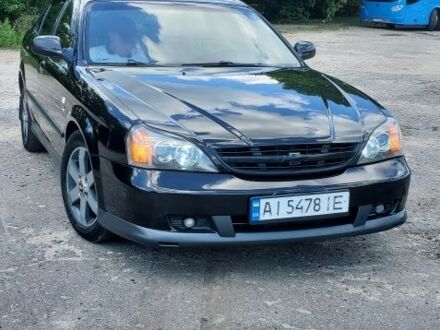 Черный Шевроле Эванда, объемом двигателя 2 л и пробегом 300 тыс. км за 3800 $, фото 1 на Automoto.ua