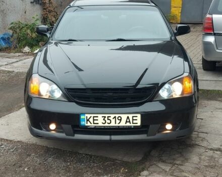 Черный Шевроле Эванда, объемом двигателя 2 л и пробегом 220 тыс. км за 3800 $, фото 1 на Automoto.ua