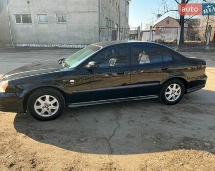 Черный Шевроле Эванда, объемом двигателя 2 л и пробегом 239 тыс. км за 3550 $, фото 1 на Automoto.ua