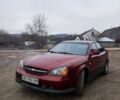 Красный Шевроле Эванда, объемом двигателя 2 л и пробегом 170 тыс. км за 1300 $, фото 1 на Automoto.ua