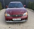 Червоний Шевроле Еванда, об'ємом двигуна 2 л та пробігом 220 тис. км за 1650 $, фото 5 на Automoto.ua