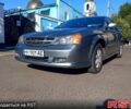 Серый Шевроле Эванда, объемом двигателя 2 л и пробегом 288 тыс. км за 3400 $, фото 1 на Automoto.ua