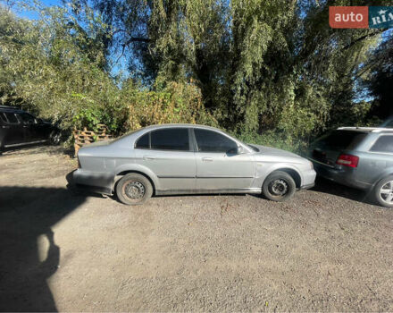 Серый Шевроле Эванда, объемом двигателя 2 л и пробегом 300 тыс. км за 1300 $, фото 1 на Automoto.ua