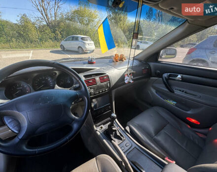 Серый Шевроле Эванда, объемом двигателя 2 л и пробегом 350 тыс. км за 3111 $, фото 9 на Automoto.ua