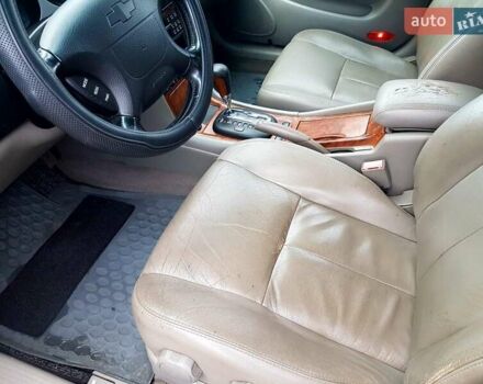 Сірий Шевроле Еванда, об'ємом двигуна 2.5 л та пробігом 147 тис. км за 3750 $, фото 32 на Automoto.ua