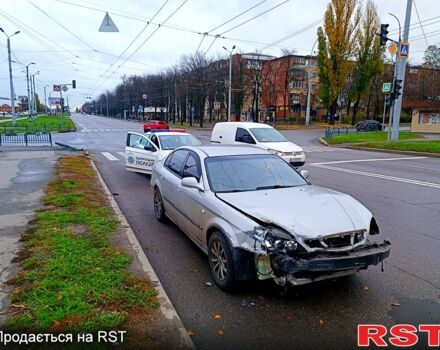 Серый Шевроле Эванда, объемом двигателя 2 л и пробегом 220 тыс. км за 1200 $, фото 3 на Automoto.ua