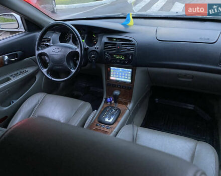 Серый Шевроле Эванда, объемом двигателя 2 л и пробегом 210 тыс. км за 3300 $, фото 6 на Automoto.ua