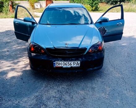 Сірий Шевроле Еванда, об'ємом двигуна 2 л та пробігом 300 тис. км за 2300 $, фото 1 на Automoto.ua