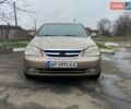 Бежевий Шевроле Лачетті, об'ємом двигуна 1.8 л та пробігом 240 тис. км за 3700 $, фото 1 на Automoto.ua