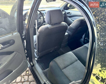 Черный Шевроле Лачетти, объемом двигателя 1.8 л и пробегом 142 тыс. км за 7400 $, фото 17 на Automoto.ua