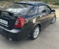 Черный Шевроле Лачетти, объемом двигателя 1.8 л и пробегом 300 тыс. км за 2600 $, фото 3 на Automoto.ua