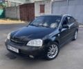 Черный Шевроле Лачетти, объемом двигателя 1.8 л и пробегом 300 тыс. км за 2600 $, фото 1 на Automoto.ua