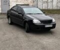 Черный Шевроле Лачетти, объемом двигателя 1.6 л и пробегом 400 тыс. км за 2000 $, фото 2 на Automoto.ua