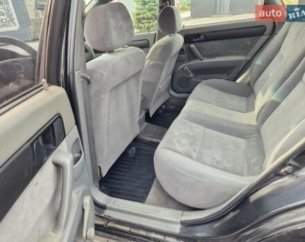 Черный Шевроле Лачетти, объемом двигателя 1.6 л и пробегом 380 тыс. км за 3990 $, фото 1 на Automoto.ua