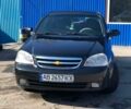 Черный Шевроле Лачетти, объемом двигателя 1.8 л и пробегом 260 тыс. км за 3800 $, фото 1 на Automoto.ua