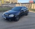 Черный Шевроле Лачетти, объемом двигателя 1.8 л и пробегом 208 тыс. км за 1999 $, фото 1 на Automoto.ua