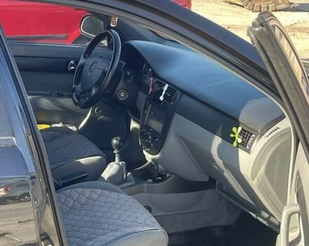 Черный Шевроле Лачетти, объемом двигателя 1.8 л и пробегом 220 тыс. км за 5200 $, фото 2 на Automoto.ua