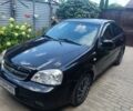 Черный Шевроле Лачетти, объемом двигателя 1.8 л и пробегом 290 тыс. км за 3709 $, фото 1 на Automoto.ua