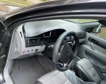 Черный Шевроле Лачетти, объемом двигателя 1.6 л и пробегом 264 тыс. км за 1999 $, фото 2 на Automoto.ua