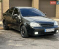 Черный Шевроле Лачетти, объемом двигателя 1.8 л и пробегом 248 тыс. км за 4250 $, фото 1 на Automoto.ua